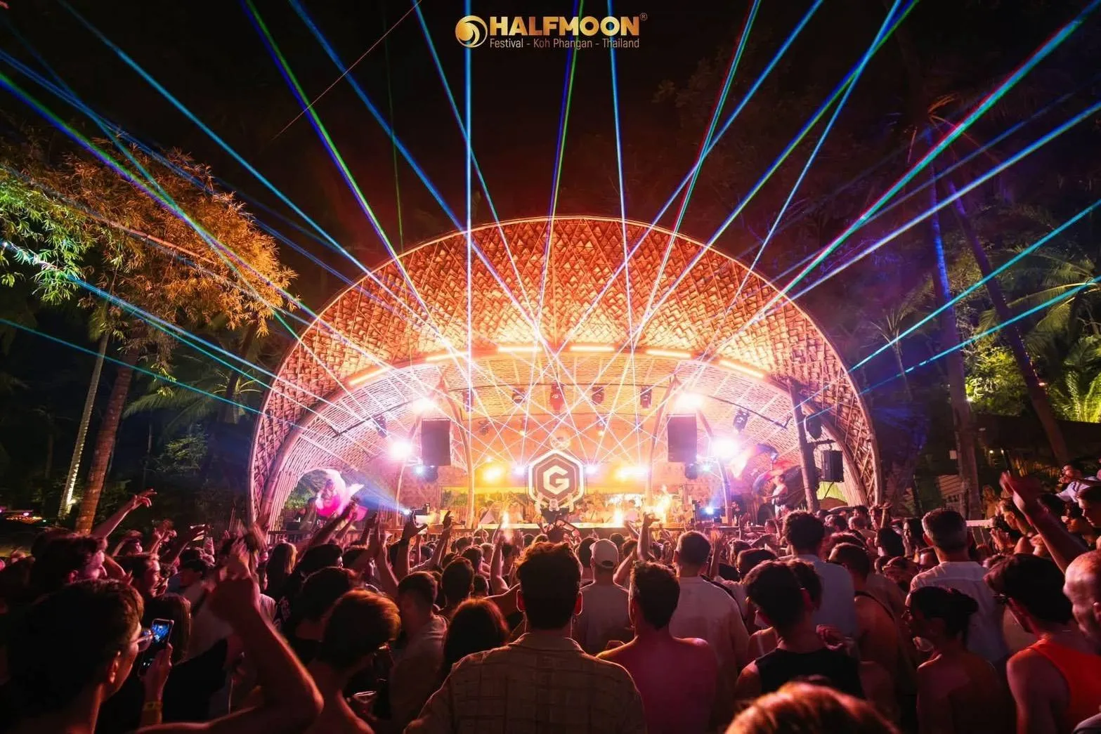 Halfmoon Harmony Beach Party Koh Phangan – orange-lit dome stage with laser beams at night