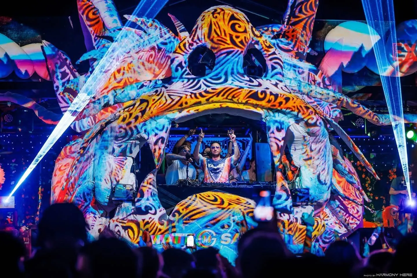 Jungle Experience Party Koh Phangan – colourful creature-head DJ booth lit with lasers at night