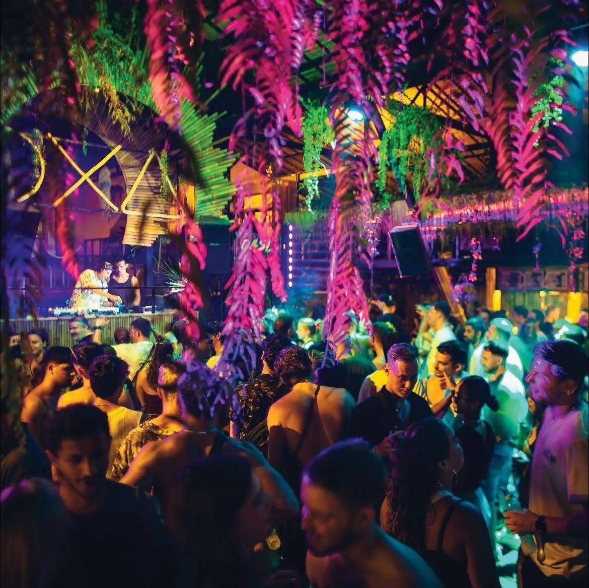 OXA Jungle Party Koh Phangan – dancers under pink hanging jungle decorations at night