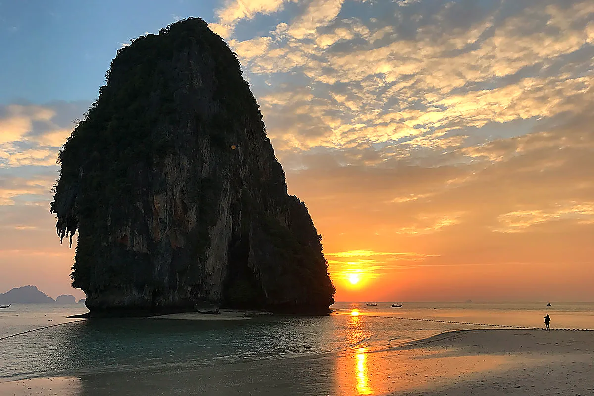 Sunset behind a limestone cliff on the beach